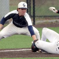 Grady Lesperance reaches down to tag out a Lawton MacArthur base runner