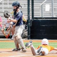 Austin Steffler looks a pickoff throw to the plate into his glove