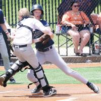 Garrett Moss collides with a Putnam City catcher