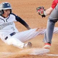 Jovanny Rosas reacts as he tries to make a wide slide into third base