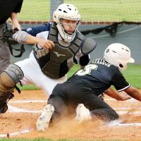 Brayden Fulton reaches out to tag a runner at the plate