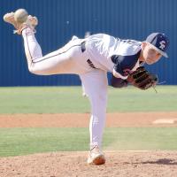 Ryker Crain watches a pitch fly toward the plate