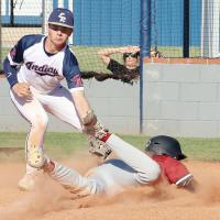 Ryker Crain reaches down to tag a Weatherford base runner on a play at the plate