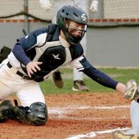 Gabe Compton reaches out to tag a Bishop McGuinness runner at the plate