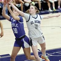 Halli Ferguson (5) reaches around a Noble player to get her fingers on an offensive rebound attempt