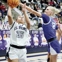 Jaida Richardson shoots a jumper past a block attempt