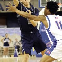 Bradley Island makes a pass over the arm of a Tulsa Memorial defender
