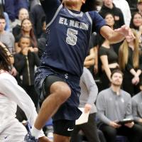 Jacob Nichols (5) shoots a fastbreak layup