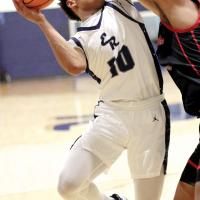 Kaleb Blackwolf  gets fouled on the arm by a Crossings Christian player