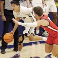 Carter Roman Nose dribbles around a Carl Albert defender