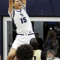 Hezakiya Satepauhoodle (15) yells as he slams down the first two points of the game