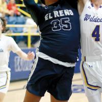 James Reveles makes a power move to the basket