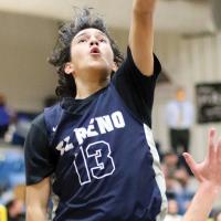 Ryan Island drives to the basket on a layup attempt
