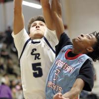 Carter Roman Nose outjumps a Western Heights defender for a slam dunk