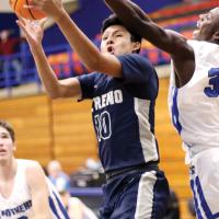 Evan Roman Nose uses his body to screen off a defender