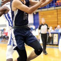 Ryan Island ducks under a defender for a layup
