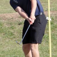Cooper Park follows his chip shot as it bounces toward the pin