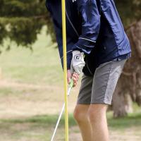 Bryan Richardson rolls a putt toward the hole