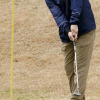 Matt Solansky rolls a putt toward the cup