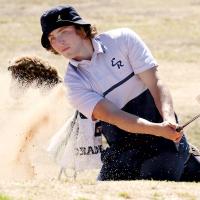 Cooper Park watches the ball fly out of the sand trap