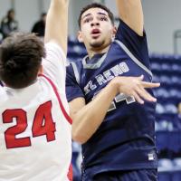 Tre Davis shoots a hook shot over a Mustang defender
