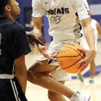 Ryan Island is fouled while driving to the basket