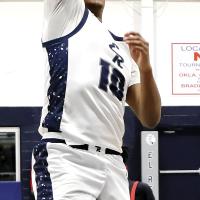 Jonathan Reed shoots a running jumper