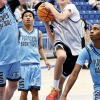 Graham Philips weaves through three Enid defenders