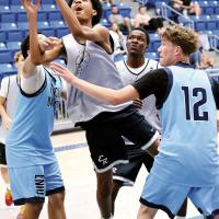 Mason Beartrack gets fouled while taking the ball to the basket