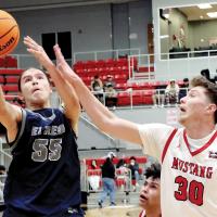 Alex Elizondo shoots over a Mustang defender