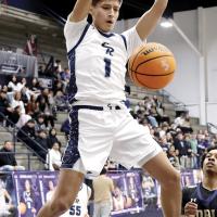 Carter Roman Nose watches his dunk fall to the ground