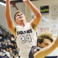 Kolton Hunt is fouled while shooting a layup