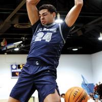 Tre Davis slams down two of his nine points in the first period