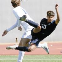 Edgar Garcia gets flipped in the air after colliding with a Choctaw player