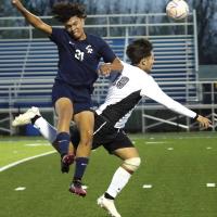 Kenneth Solis collides with a player as both were trying to possess a pass