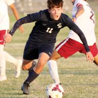 Cohlton Fertig dribbles past a defender