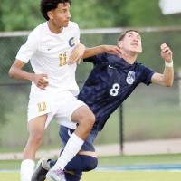 Alan Gonsalez gets his arms and legs tangled with a Classen SAS player