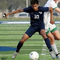 Edgar Garcia uses his body to screen off a defender