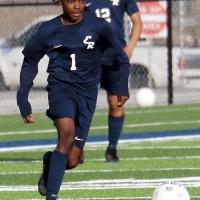 Kevin Frazier dribbles up the field