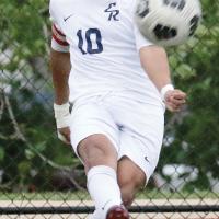 Edgar Perez follows through on a corner kick