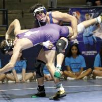 Hunter Davidson lifts Cache Wilson into a throw for a takedown