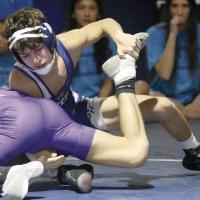 Terry Guzman grabs the ankle of a Chickasha grappler