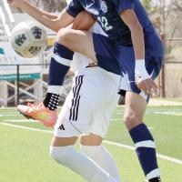 Vicente Saldana Barbosa collides with a Yukon player