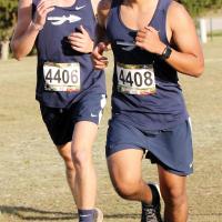 Cole Strong and Erik Vazquez run together at the front section