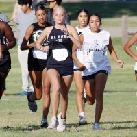 A pack of EHS teammates come off the starting line of the El Reno Cross Country Meet