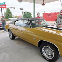 El Reno Cruisers members chat around this classic Chevy