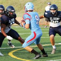 Darius Moore (left) and Luke Claborn put pressure on a Lawton Ike QB