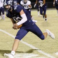 Kolton Hunt runs in the open field after catching a pass