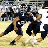 Mikey Devereaux forces an Altus ball carrier to change directions