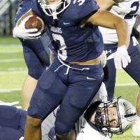 Malachi Nicholson breaks a tackle